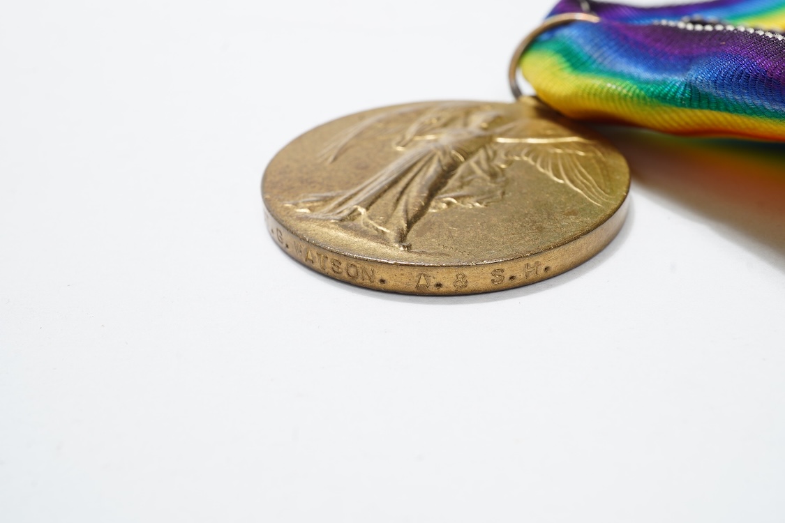 A First World War medal trio awarded to 2140 SJT. G. Watson. Argyll and Sutherland Highlanders, together with the related cap badge and two photographs of Watson in Highlanders uniform and printed as postcards
